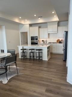 3472 Fishpond Circle Dacula, GA 30019 - Photo 13 of 72 a large white kitchen with lots of counter space and stainless steel appliances