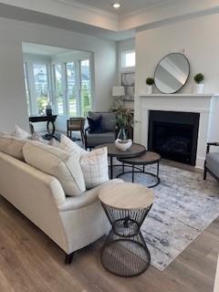 3472 Fishpond Circle Dacula, GA 30019 - Photo 3 of 72 a living room with furniture a fireplace a lamp and windows