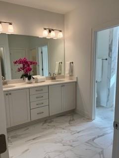 3472 Fishpond Circle Dacula, GA 30019 - Photo 40 of 72 a bathroom with a sink vanity and a mirror