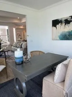 a living room with furniture a fireplace and a window