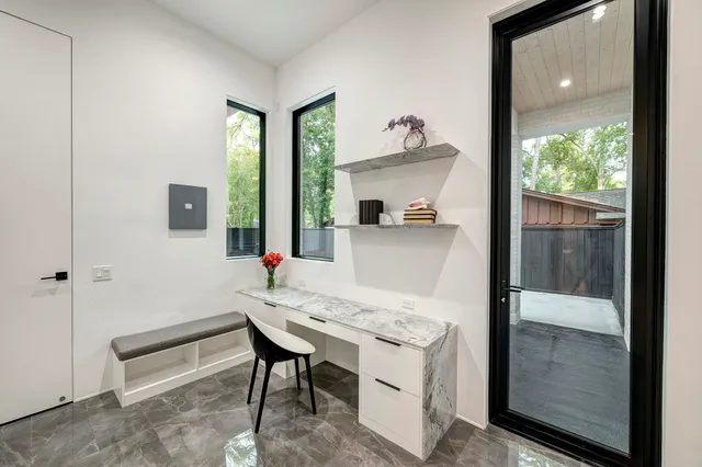 a kitchen with granite countertop a stove and a refrigerator