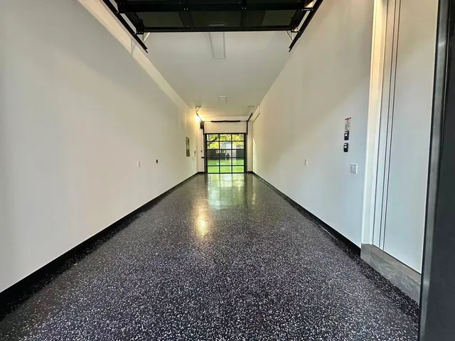 a bathroom with a double vanity sink mirror and shower