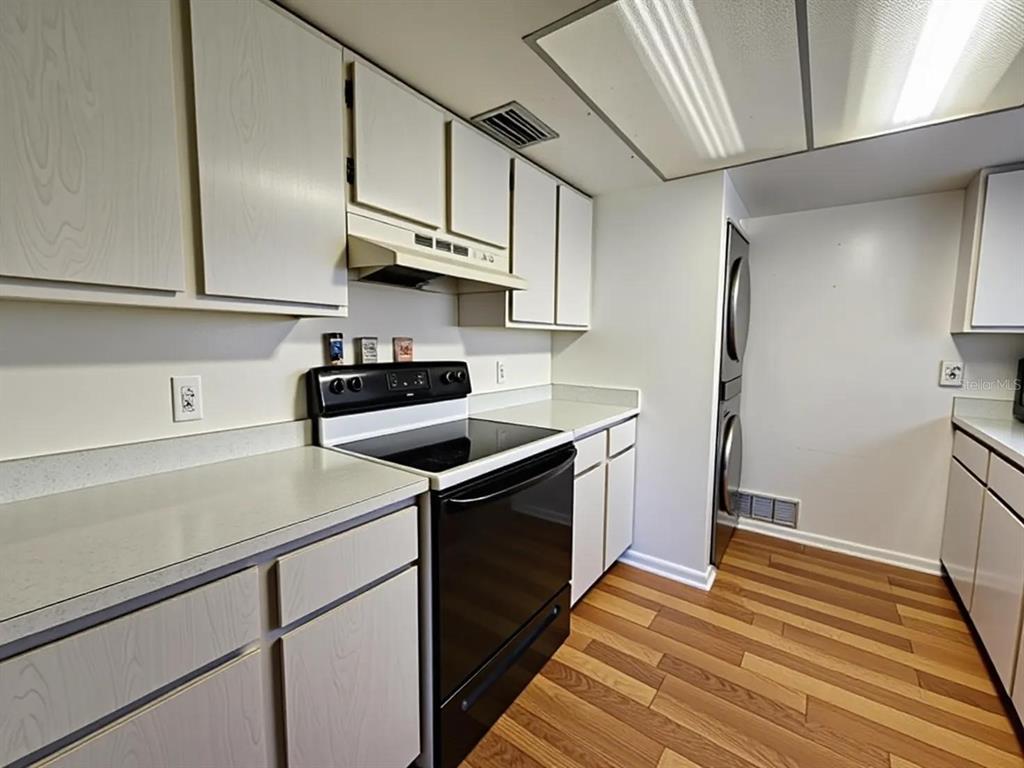 626 Fairways Circle, Unit A Ocala, FL 34472 - Photo 11 of 21 a kitchen with stainless steel appliances granite countertop a sink a stove and refrigerator