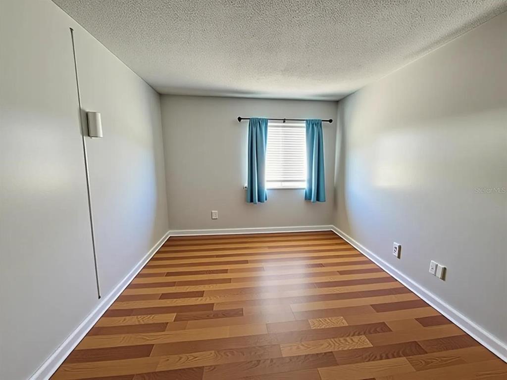 626 Fairways Circle, Unit A Ocala, FL 34472 - Photo 16 of 21 a view of empty room with wooden floor