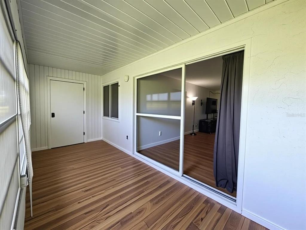 626 Fairways Circle, Unit A Ocala, FL 34472 - Photo 18 of 21 an empty room with wooden floor and closet