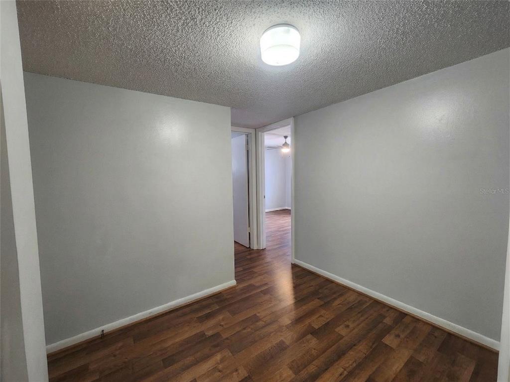 626 Fairways Circle, Unit A Ocala, FL 34472 - Photo 20 of 21 a view of an empty room with wooden floor