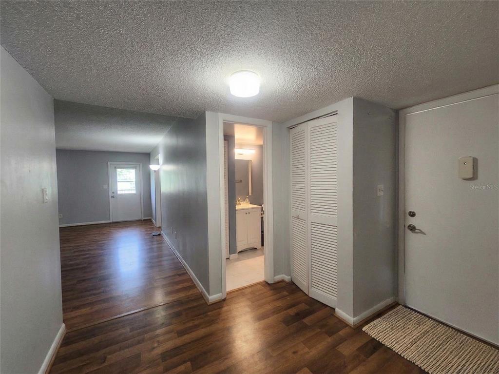 626 Fairways Circle, Unit A Ocala, FL 34472 - Photo 21 of 21 an empty room with wooden floor and windows