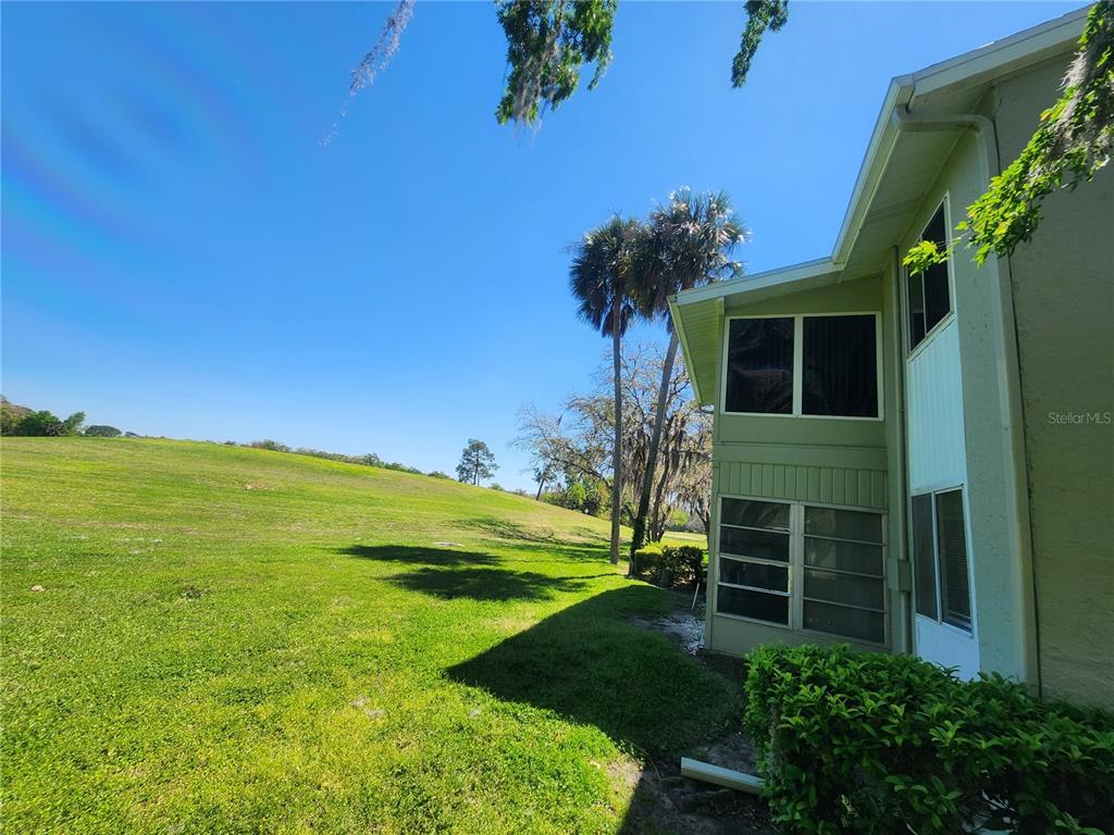 626 Fairways Circle, Unit A Ocala, FL 34472 - Photo 7 of 21 a front view of a house with a garden