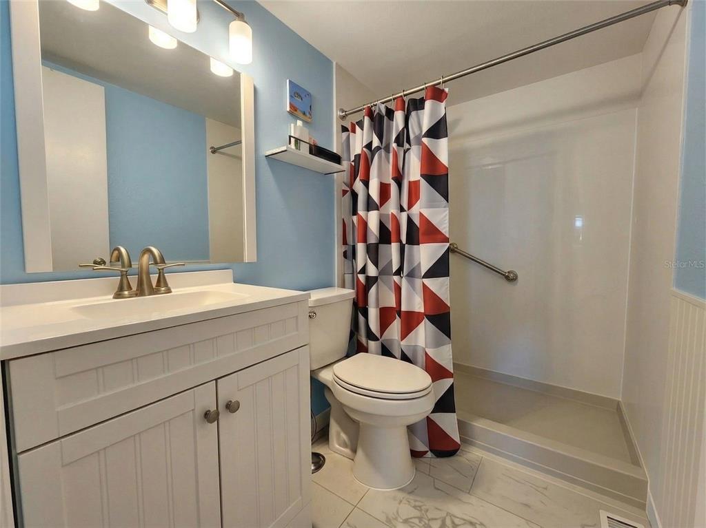626 Fairways Circle, Unit A Ocala, FL 34472 - Photo 10 of 21 a bathroom with a sink a toilet and shower