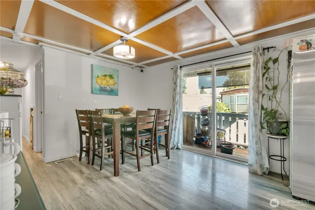 a view of a dining room with furniture and wooden floor