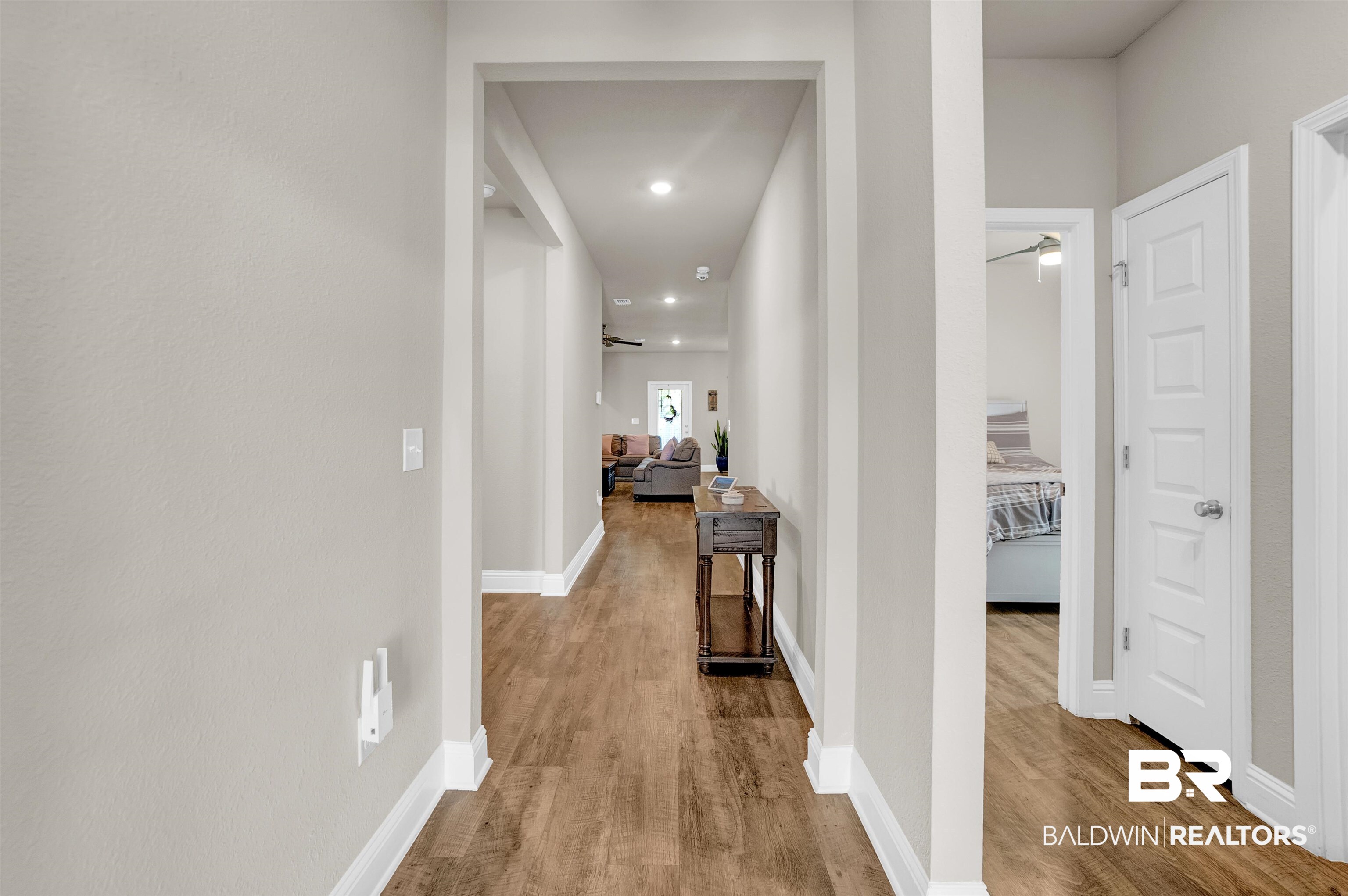 31671 Memphis Loop Daphne, AL 36527 - Photo 6 of 51 Hall with baseboards, wood finished floors, and recessed lighting