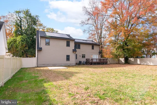 a view of a house with a yard and garage