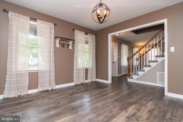 a view of an entryway with wooden floor