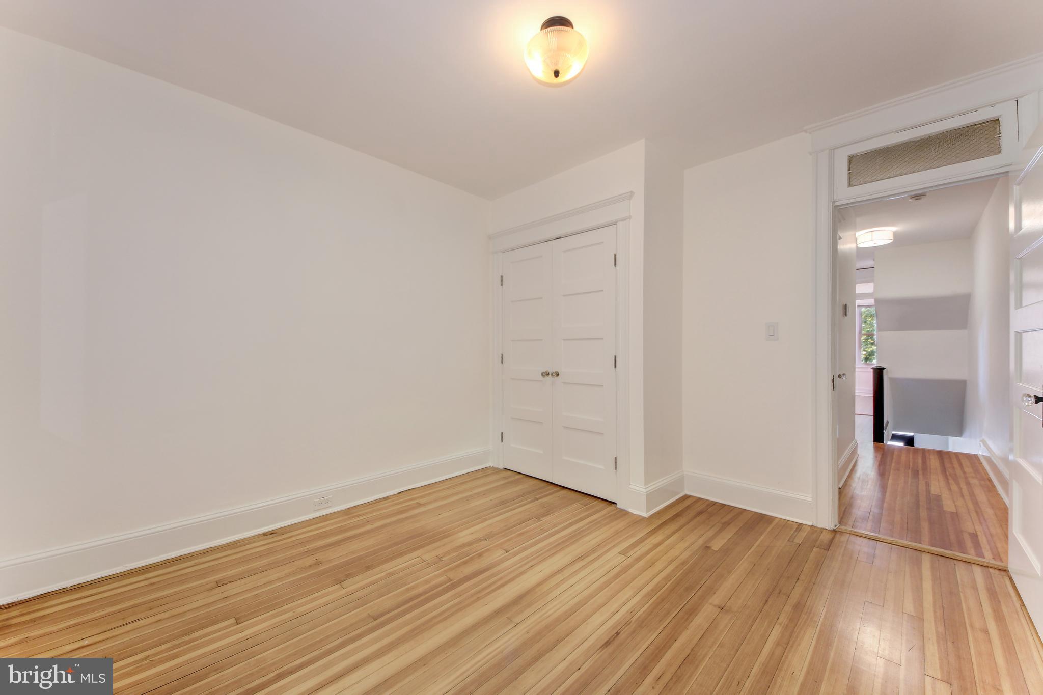 1321 Spring Road Northwest Washington, DC 20010 - Photo 15 of 30 a view of a room with wooden floor