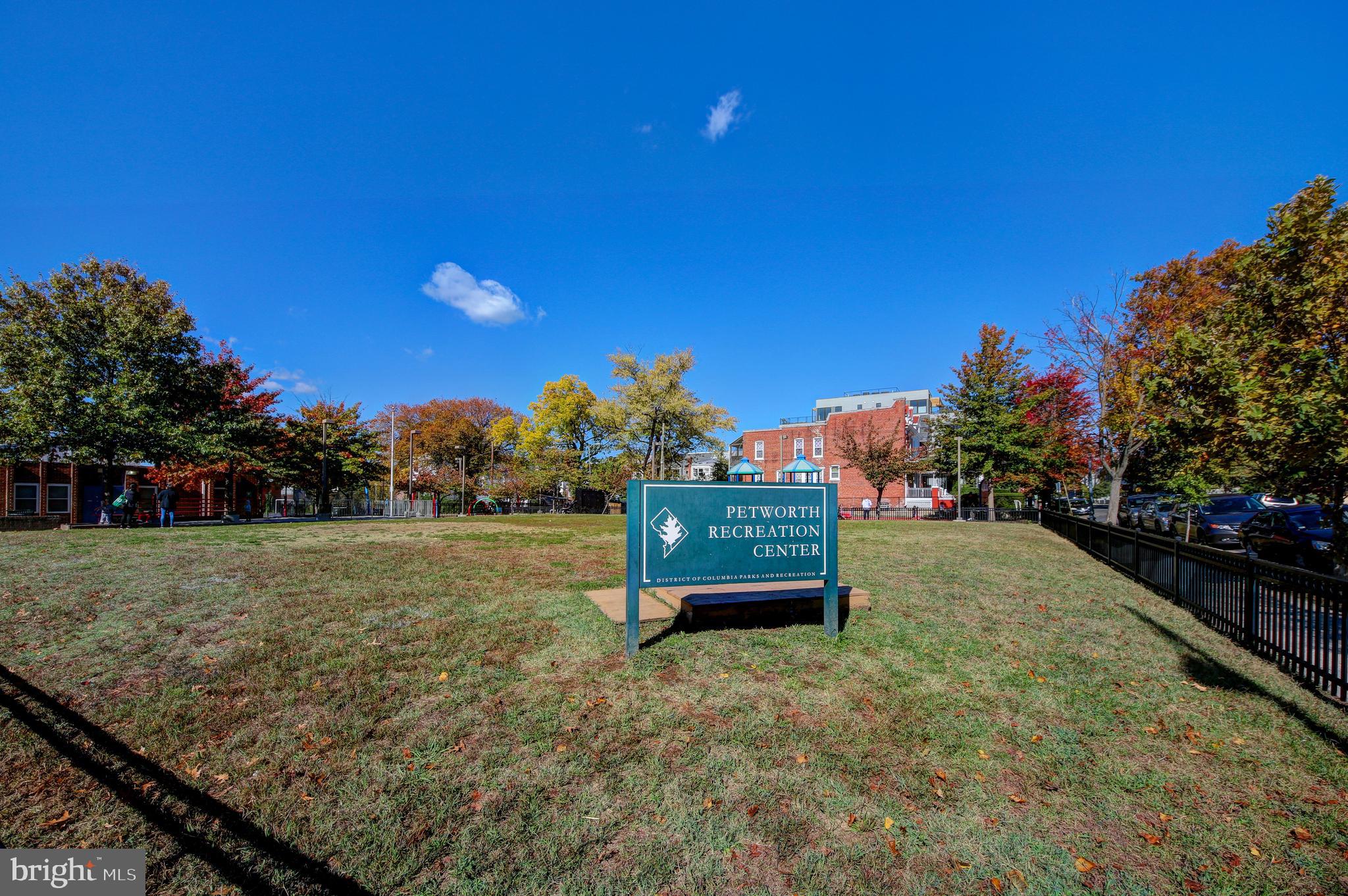 1321 Spring Road Northwest Washington, DC 20010 - Photo 27 of 30 a green field with trees in the background