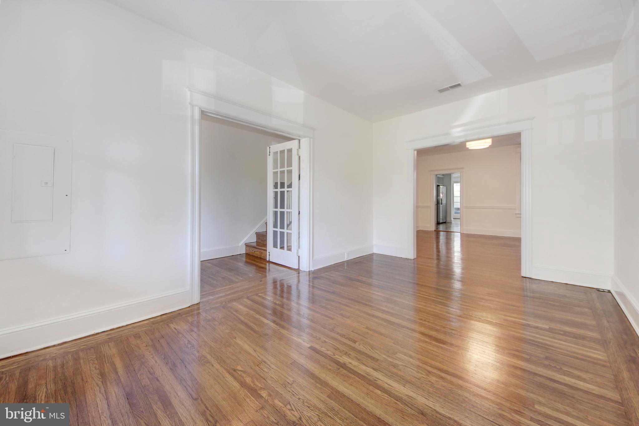 1321 Spring Road Northwest Washington, DC 20010 - Photo 5 of 30 a view of empty room with wooden floor