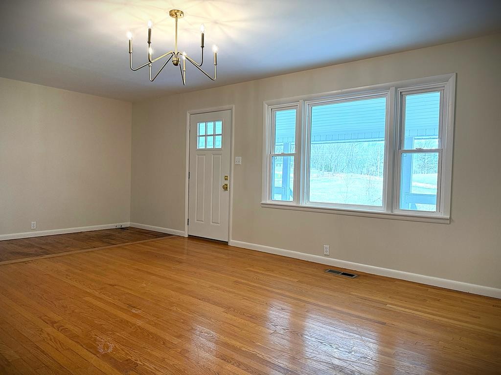 118 Collins Road Allons, TN 38541 - Photo 12 of 64 a view of empty room with wooden floor and fan