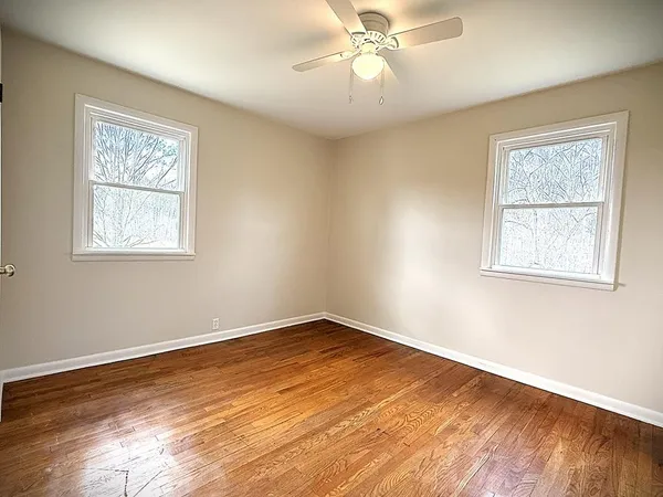 a view of a room with wooden walls