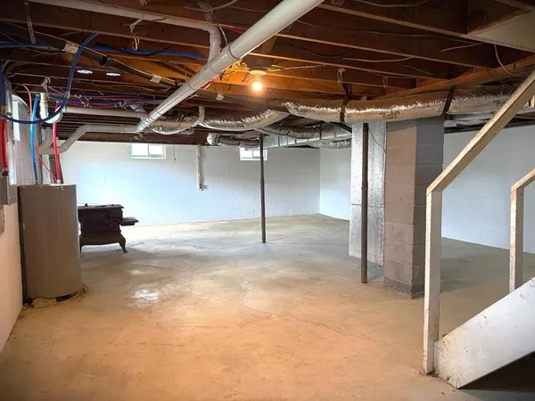 a view of a hallway with wooden floor and closet area