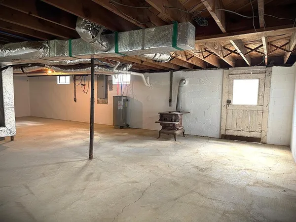 a bathroom with a toilet a sink and shower