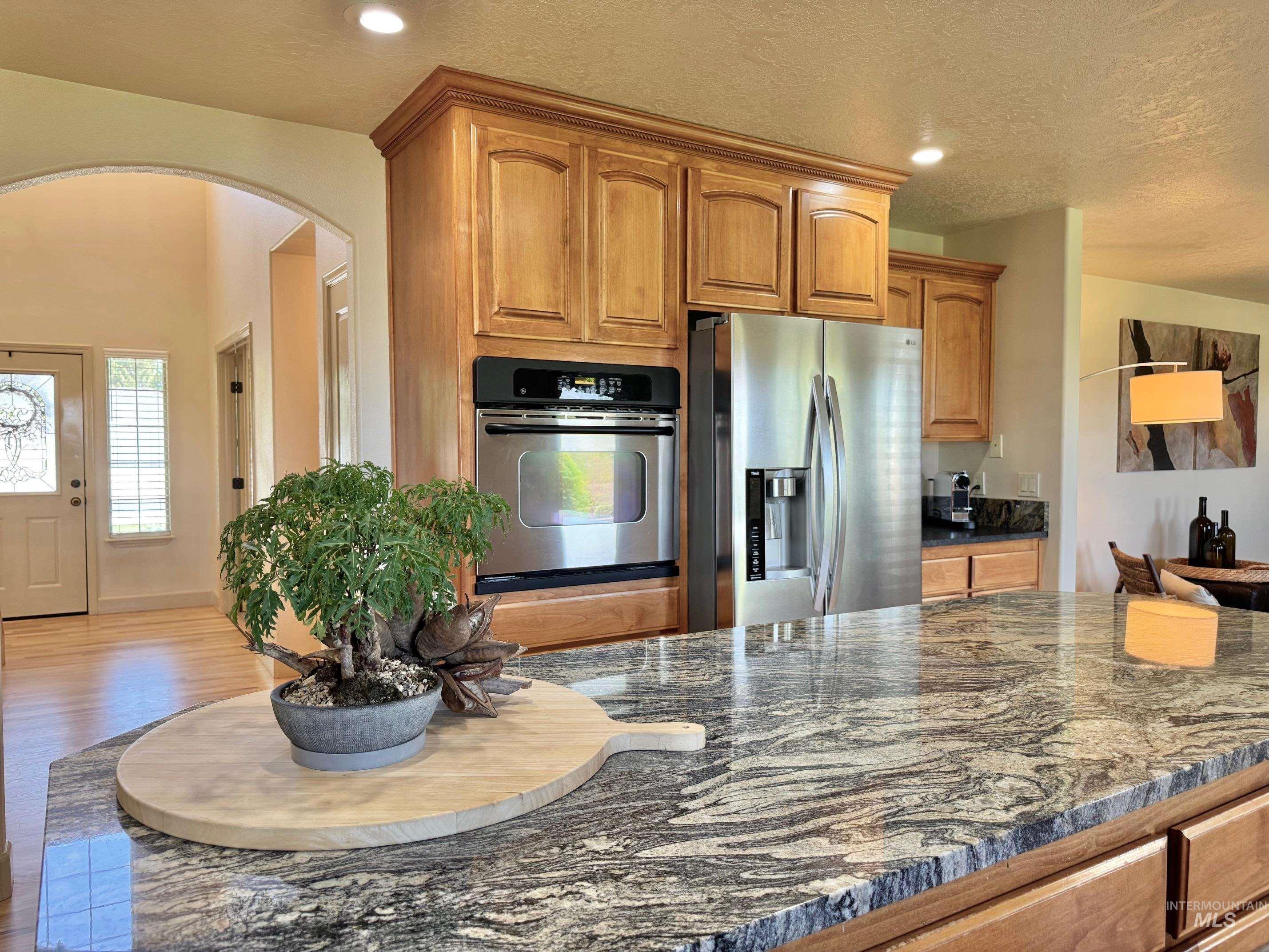9299 Kemp Road Middleton, ID 83644 - Photo 12 of 50 Spacious kitchen island featuring a variegated stone countertop