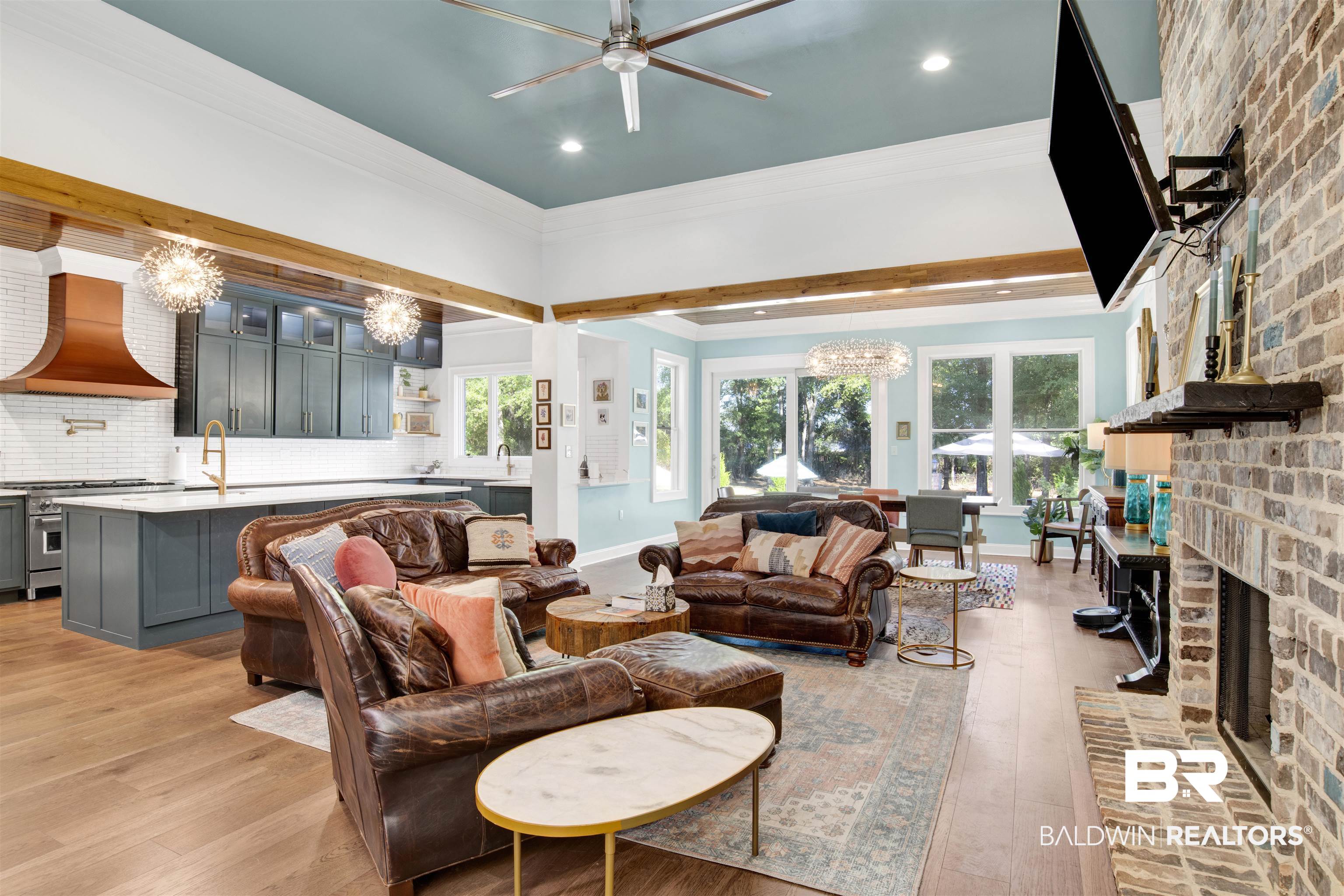 11116 Redfern Road Daphne, AL 36526 - Photo 21 of 46 Living area with a chandelier, light wood-style flooring, ornamental molding, a brick fireplace, and recessed lighting