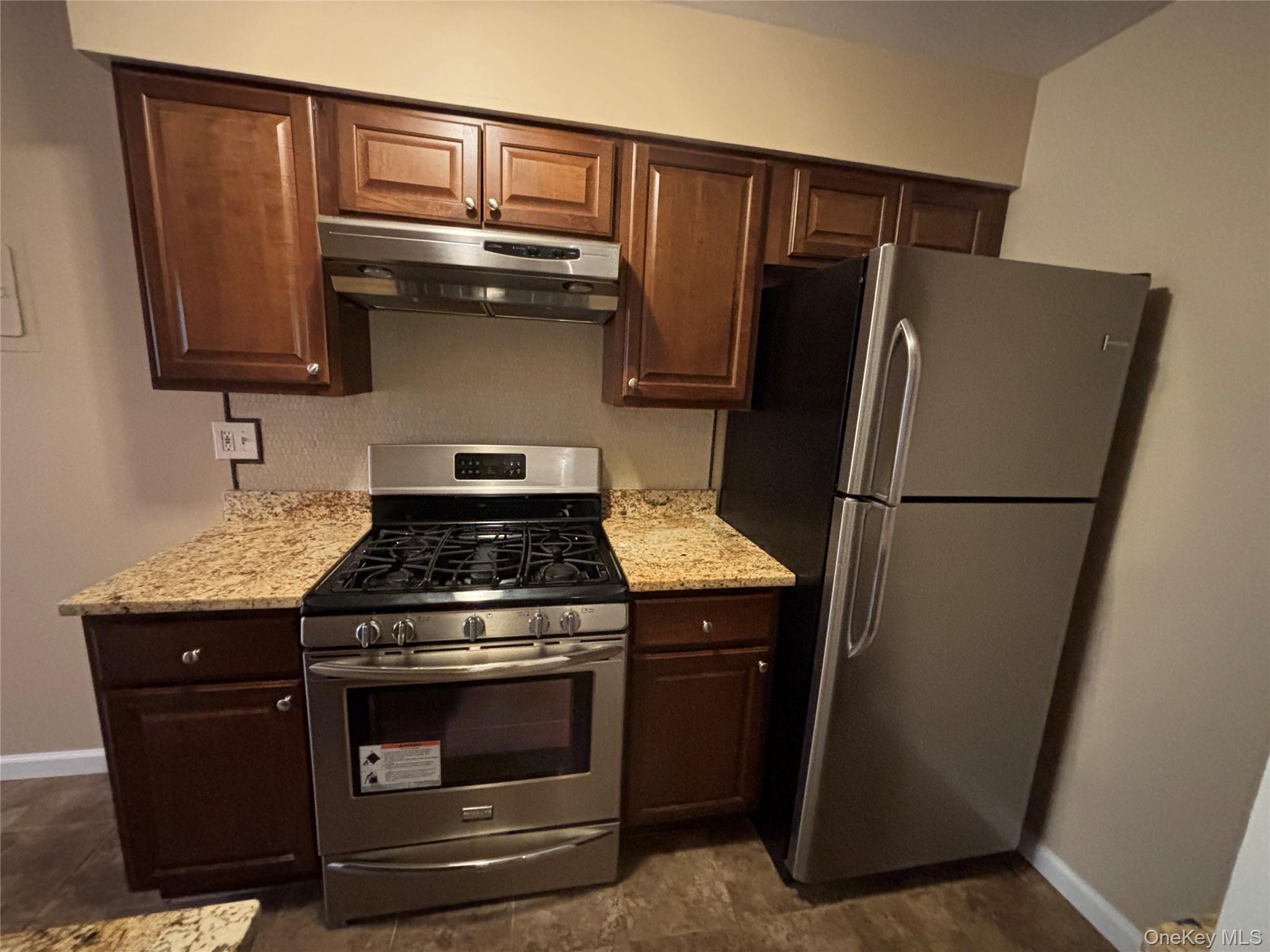 4 Colonial Road, Unit 92 Beacon, NY 12508 - Photo 1 of 9 a stove top oven sitting inside of a kitchen