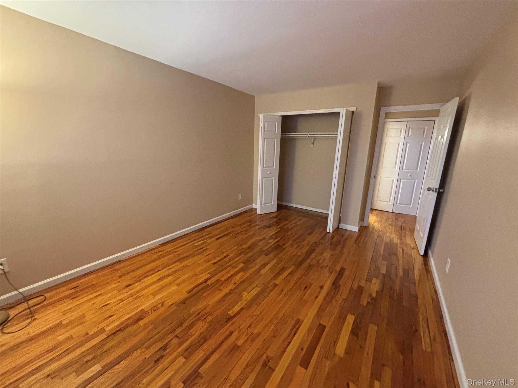 4 Colonial Road, Unit 92 Beacon, NY 12508 - Photo 8 of 9 a view of a room with wooden floor and glass door
