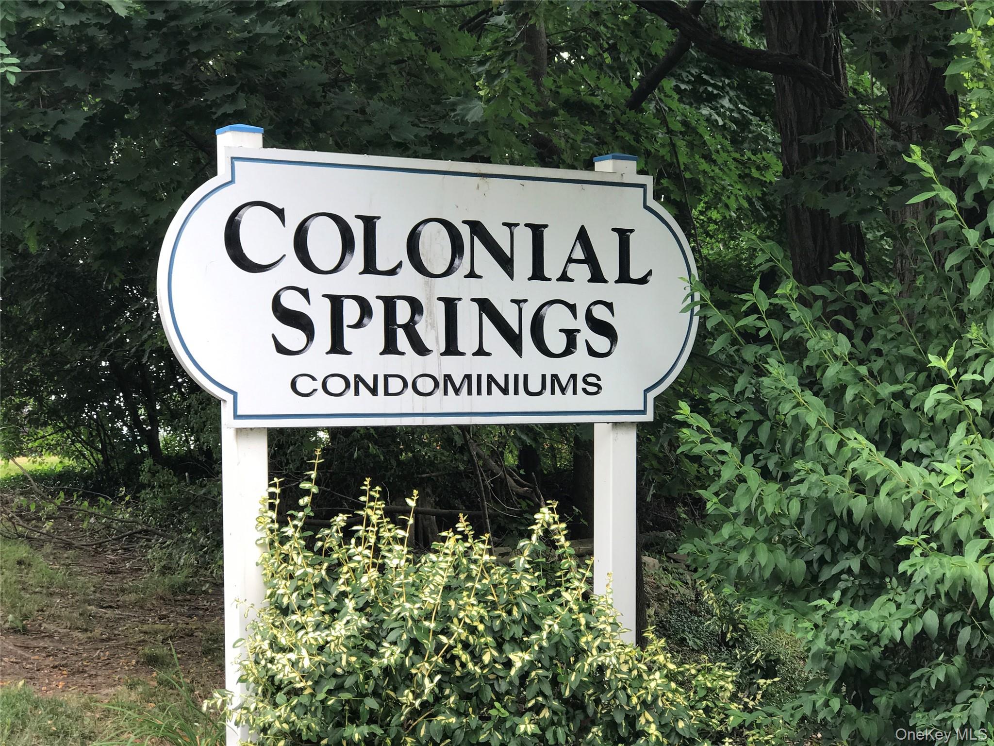 4 Colonial Road, Unit 92 Beacon, NY 12508 - Photo 9 of 9 a sign broad in front of red brick house