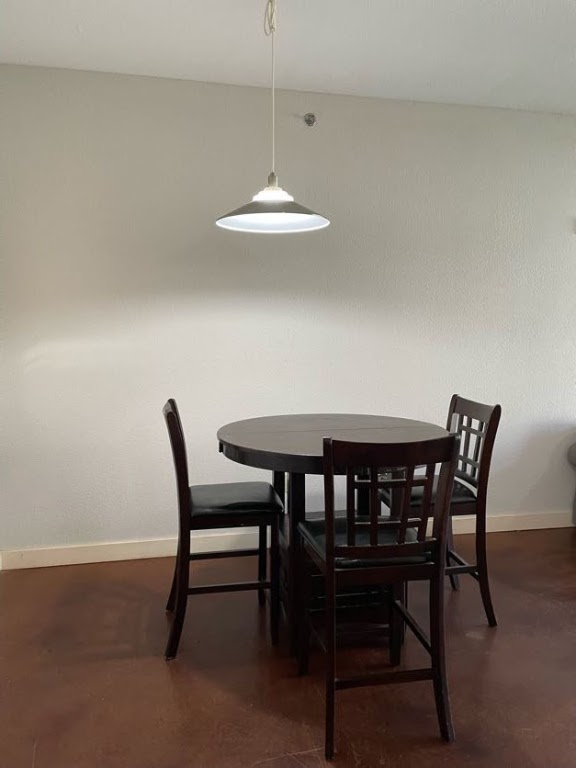 711 West 26th Street, Unit 510 Austin, TX 78705 - Photo 6 of 16 a view of a dining room with a table and chairs