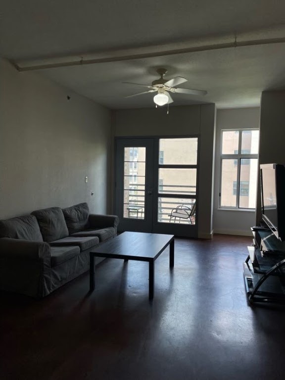 711 West 26th Street, Unit 510 Austin, TX 78705 - Photo 7 of 16 a living room with furniture and a large window