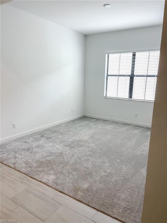 14684 Kingfisher Loop Naples, FL 34120 - Photo 12 of 18 an empty room with a window