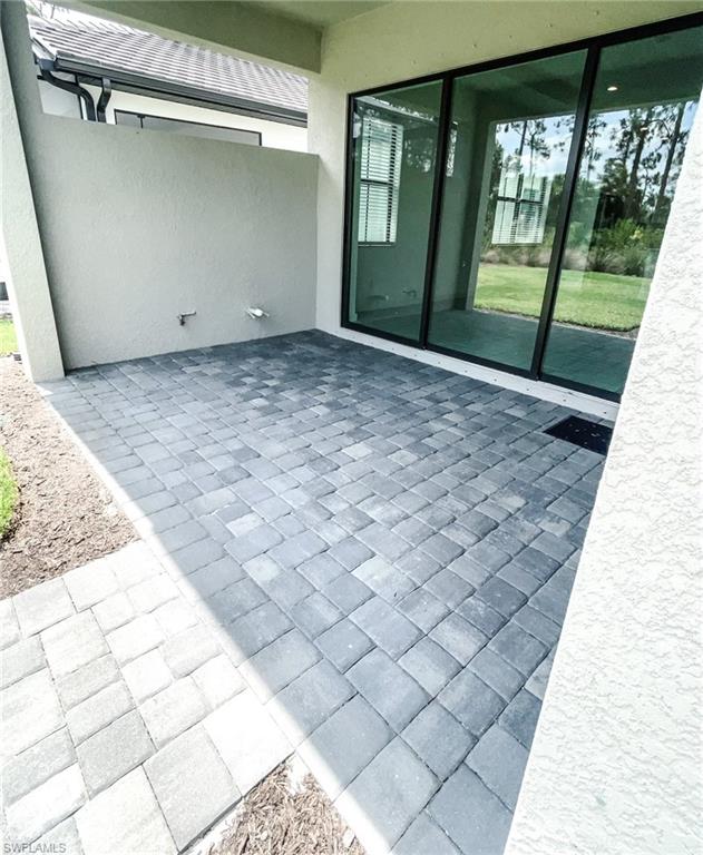 14684 Kingfisher Loop Naples, FL 34120 - Photo 14 of 18 a view of an empty room with a window