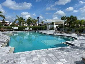 14684 Kingfisher Loop Naples, FL 34120 - Photo 18 of 18 a view of a swimming pool and outdoor space