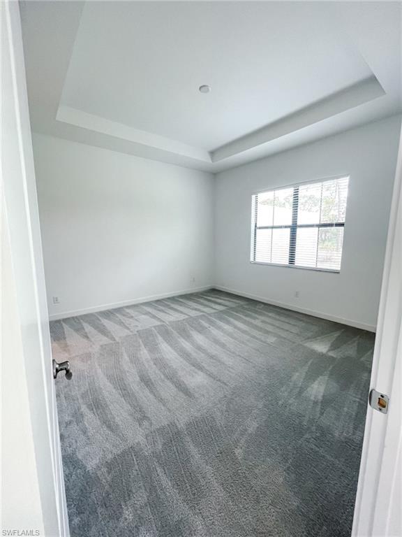 14684 Kingfisher Loop Naples, FL 34120 - Photo 8 of 18 an empty room with a window