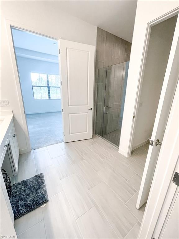 14684 Kingfisher Loop Naples, FL 34120 - Photo 10 of 18 a view of hallway with window and stairs