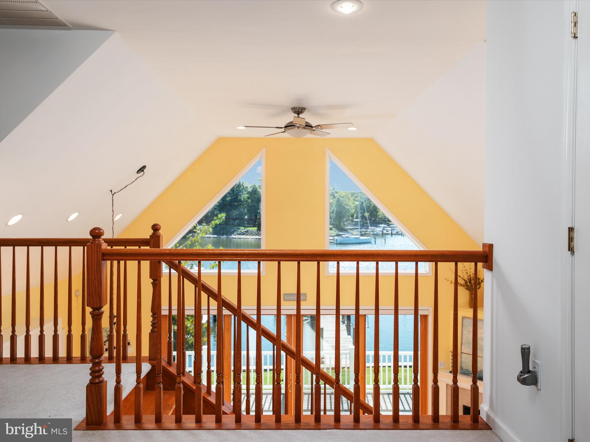 8206 Riverside Drive Pasadena, MD 21122 - Photo 42 of 62 Trapezoid windows atop 2 sets of sliding doors