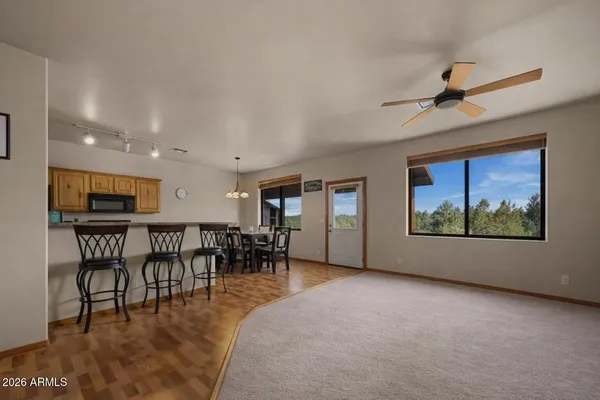 a view of a dining room with furniture window and outside view