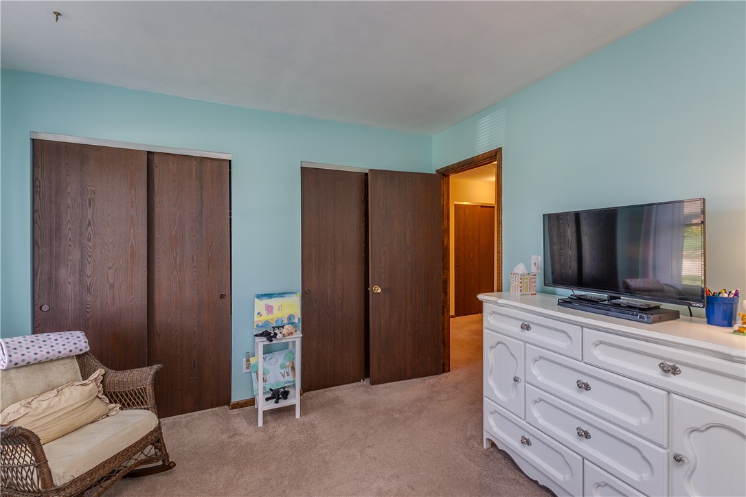 4210 Pleasanton Road Englewood, OH 45322 - Photo 23 of 34 This cozy bedroom features durable carpet flooring and convenient sliding closet doors.