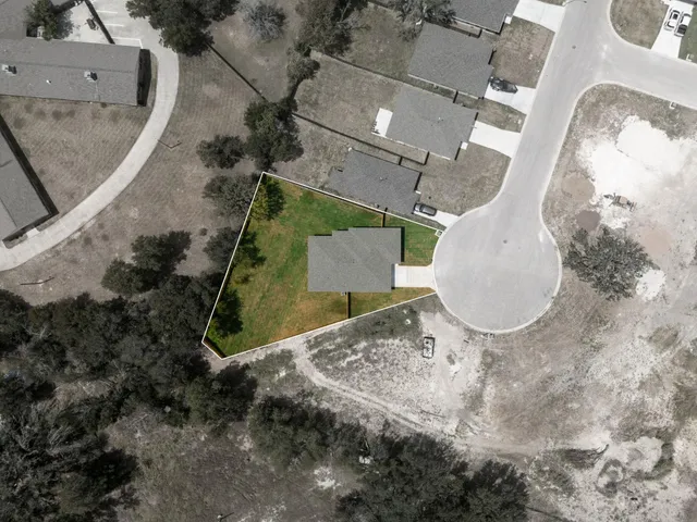 an aerial view of a highlighted house