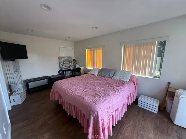 an open kitchen with kitchen island stainless steel appliances a sink stove and cabinets