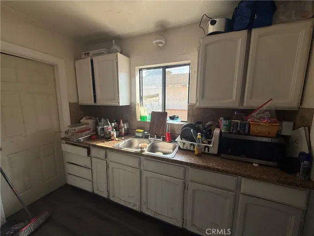 a kitchen with a stove and a refrigerator