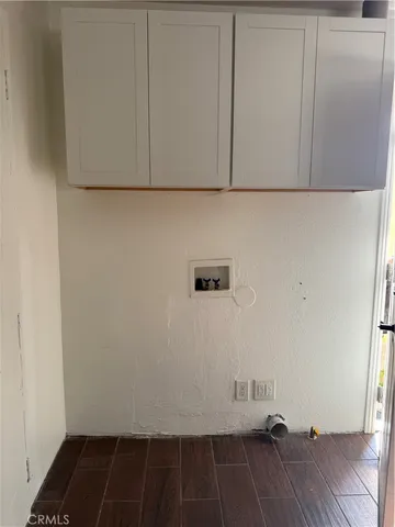 a view of hallway with wooden floor