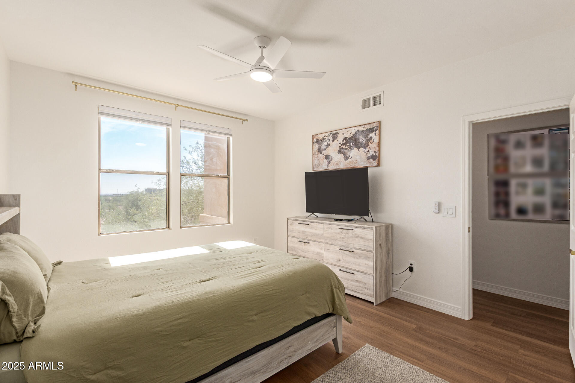 20100 North 78th Place, Unit 2083 Scottsdale, AZ 85255 - Photo 11 of 40 a bedroom with a bed and a flat screen tv