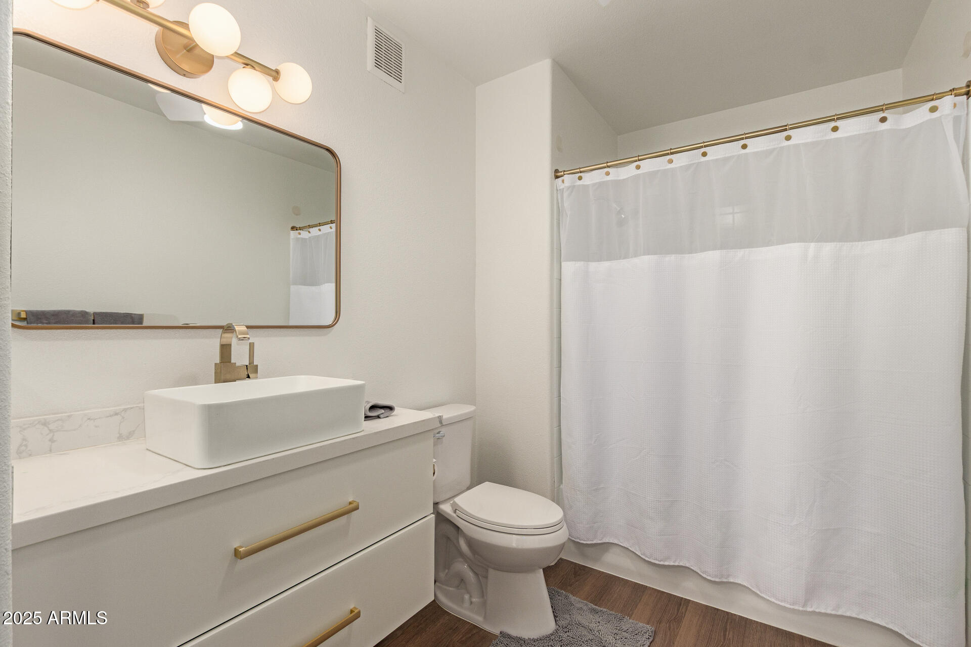 20100 North 78th Place, Unit 2083 Scottsdale, AZ 85255 - Photo 13 of 40 a bathroom with a sink a toilet and a mirror
