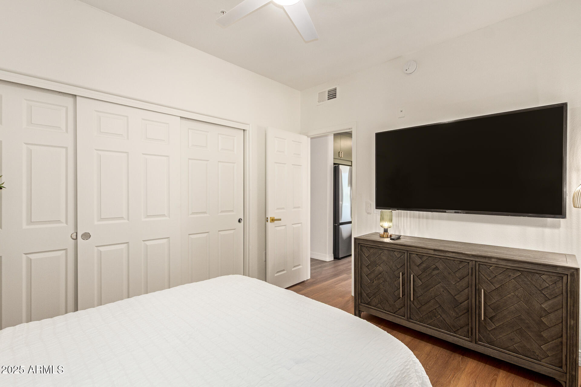 20100 North 78th Place, Unit 2083 Scottsdale, AZ 85255 - Photo 16 of 40 a bedroom with a bed and a flat screen tv