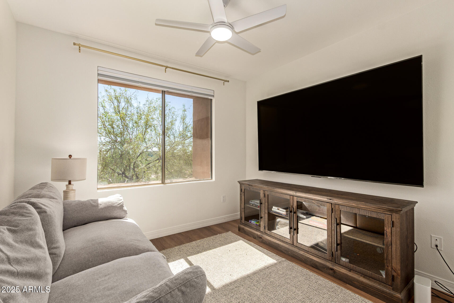 20100 North 78th Place, Unit 2083 Scottsdale, AZ 85255 - Photo 18 of 40 a living room with furniture and a flat screen tv