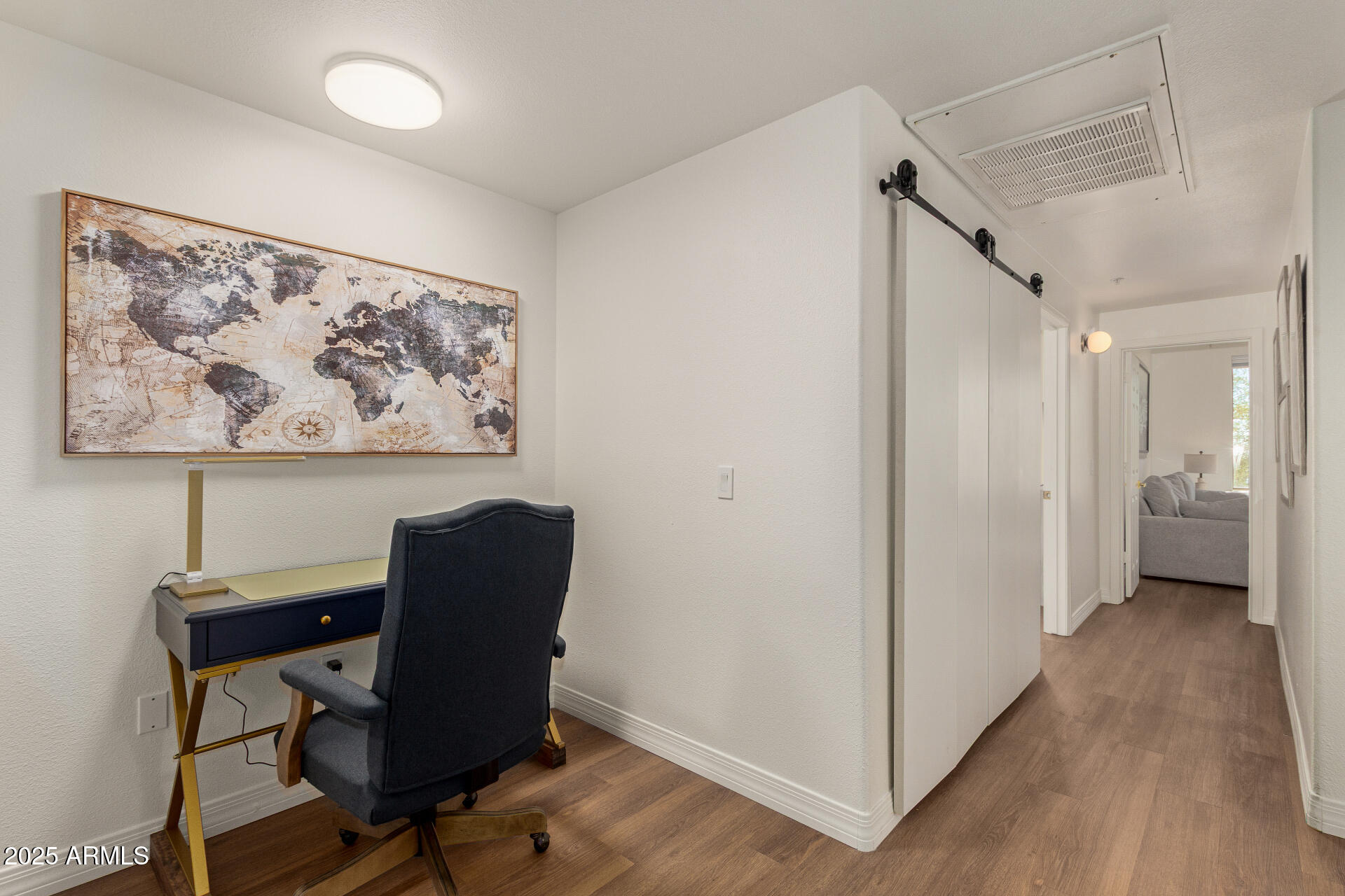 20100 North 78th Place, Unit 2083 Scottsdale, AZ 85255 - Photo 21 of 40 a view of a workspace with furniture and wooden floor