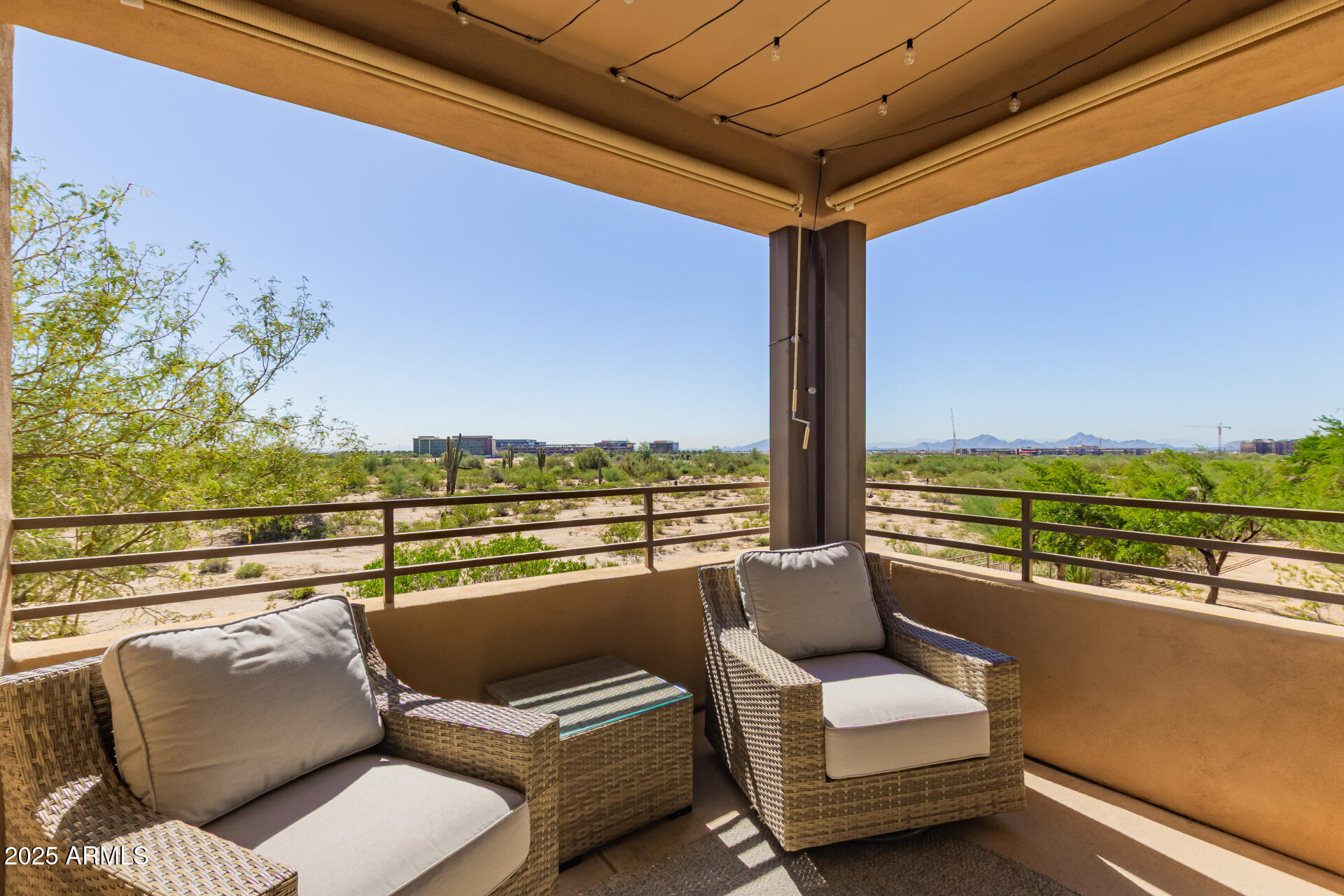 20100 North 78th Place, Unit 2083 Scottsdale, AZ 85255 - Photo 25 of 40 a view of a roof deck with couches and potted plants