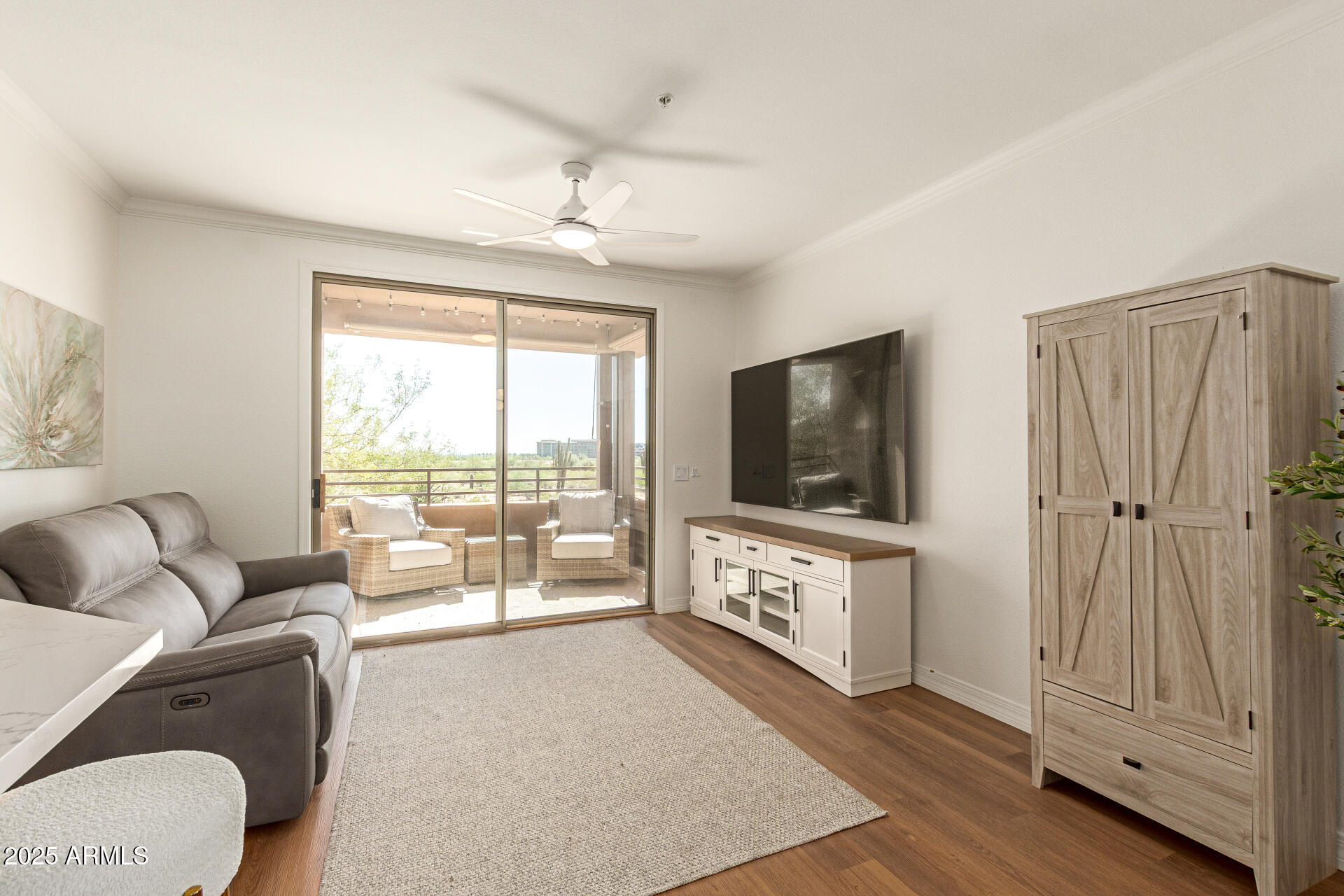 20100 North 78th Place, Unit 2083 Scottsdale, AZ 85255 - Photo 3 of 40 a living room with furniture and a flat screen tv